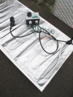 Thermostatically controlled electric blanket being installed                               