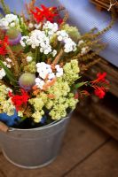 Bucket of Crocosmia 'Lucifer', Wild Teasel, Rumex - Dock flowers, Achillea ptarmica 'The Pearl' - Growing Together Nursery 