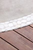 White pebble flooring, decking and stone slabs 