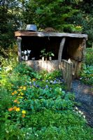 Rustic wooden shelter in vegetable garden - 'A Child's Garden in Wales', Silver Medal Winner, RHS Chelsea Flower Show 2011 
