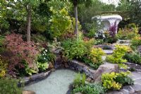 Pond in 'A Beautiful Paradise (Making memories with a green poem)' garden - Silver Medal Winner, RHS Chelsea Flower Show 2011 

