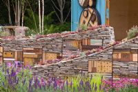 Sculptural drystone walls with built-in insect shelters and Sempervivum - Houseleeks planted on top - The Royal Bank of Canada with the RBC New Wild Garden, Silver Gilt Medal Winner - RHS Chelsea Flower Show 2011 