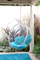 Swing seat and colourful outdoor carpet. 'The Chilstone Garden', Silver medal winner, RHS Chelsea Flower Show 2011 
