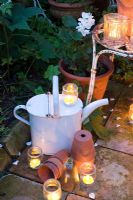 Glass jar tealights and white watering can
