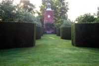 Avenue of curving Yew hedges leading to Clock Tower