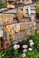 Sales area full of plants and plaster wall plaques displayed on shed