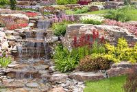 Stream cascading down rockery in the 'Glam Rock' garden by R. F. Showering Garden Design and Landscaping - Southport Flower Show 2011 