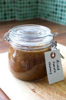 Making home-made mixed tomato chutney - jar with label 