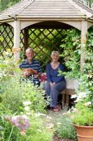 Portrait of Sue and Doug Copeland in summerhouse - Wickets, Essex NGS