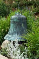 Large bell in border surrounded by Stachys byzantina - Mannington Hall, Norfolk, UK
