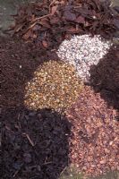 Varieties of mulches including pea shingle and chipped bark