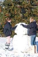 Children making a giant snow man. Gowan Cottage