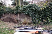 Preparing a border by adding topsoil. Before and after of London town garden.