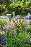 Mediterranean style planting -  Aloe trees, Rosemary, Citrus tree and Geum in  'A Monaco Garden', Gold medal winner, RHS Chelsea Flower Show 2011  