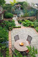 Walled garden with pond and painted trellis