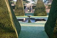 Giant Pyramid topiary and frozen fountain in The Great Court 