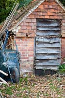 Tiled storage outhouse with wheelbarrow - Vann, Surrey