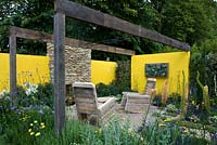 A low maintenance garden created for £13,000. Furniture made from recycled pallets - 'Summer in the Garden' - Silver medal winner - RHS Hampton Court Flower Show 2012 
