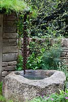 Artisan Gardens - Naturally Dry a William Wordsworth inspired garden. Water-chain leads from roof into old well. Drought tolerant plants include silver birch, Salvia 'Twilight Serenade', geraniums, Asplenium scolopendrium, Achillea and Foeniculum vulgare 'Giant Bronze'