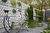 Garden designed to process and recycle waste. By using the excercise bike, waste is pumped to the top of the modular living walls and filtering units - The Soft machine garden, RHS Chelsea flower show 2012