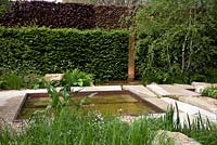 The Telegraph Garden, Gold Medal winner, RHS Chelsea Flower Show 2012. Perennials, rushes, grasses and meadow flowers around a pattern of pools in Chilmark limestone. Copper detailing
 
