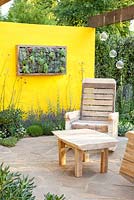 Mediterranean terrace with furniture made from recycled pallets 
