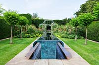 Water feature  by William Pye in the Rose Garden. Clinton Lodge, Fletching, East Sussex, UK. July