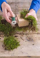 Step-by-step - wrapping wooden block in moss - creating moss parcel decoration
