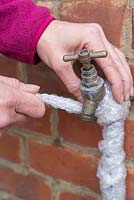 Step-by-step - Covering outdoor tap with plastic bubble wrap to protect from freezing weather