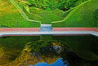 The Reflecting Pool and Hedge Garden with view to the Coppice and Yew hedges, Taxus baccata - Veddw House Garden, Monmouthshire, Wales