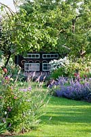 A Bavarian country garden with perennial borders and climbing roses