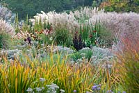 Late summer border with ornamental grasses 