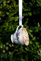 Step by step for creating hanging birdfeeders out of teacups 