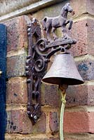 Decorative metal bell on gate - The Old Rectory, Surrey