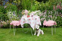Pretty table set for tea. Archie the dog keeps watch! Garden Neighbours