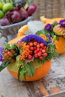 Pumpkin decorated with autumn flower display