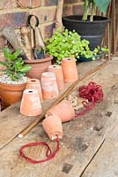 step by step -  Making a decoration from small terracotta pots to hang inside hazel wigwam