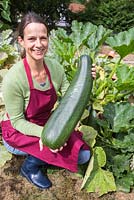 Proud woman with large harvested Marrow