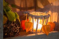 Candle holder with Physalis decoration