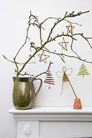 Dogwood Christmas trees, Willow Angel and Willow stars hanging from a branch
