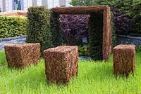 As Nature Intended Garden, Silver gilt medal winner, Chelsea Flower Show 2013. Woven willow sculptures arranged in the grass
