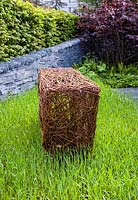 Woven willow sculptures and dry stone wall