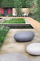 The Brewin Dolphin Garden - Large pebble seats, paving, pond, boardwalk and furniture 