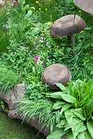 Wooden mushroom sculptures in Motor Neurone Disease - a Hebridean Weavers Garden