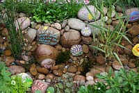 Water feature and decorative pebbles in the NSPCC Garden of Magical Childhood