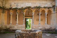 Open court in centre of the Cloisters with well head from a convent in Aquilegia.