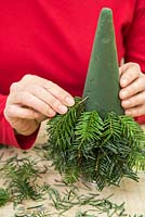 Inserting christmas tree cuttings