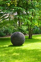 Spherical sculpture on lawn