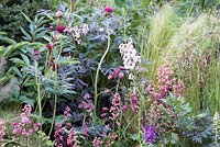 Warm pink and red informal planting with Cirsium, Astrantia, Heucheras and Peonies.  Positively Stoke-on-Trent. Chelsea Flower Show 2014
