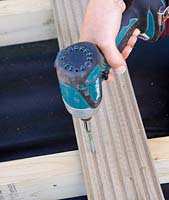 Drilling screw into deck board - decking project 